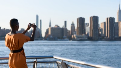 Woman taking a picture of New York City